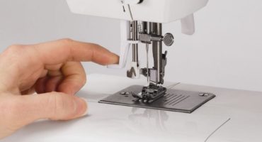 Why does the sewing machine tear the upper thread?