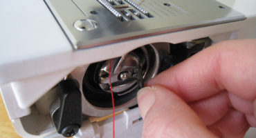 How to insert a thread, a double needle, a bobbin into a sewing machine?